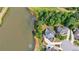 Beautiful aerial view of the rear of the home adjacent to the pond and golf course at 652 Pathview Ct, Dacula, GA 30019