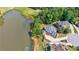 Gorgeous aerial view of the home's location on a pond near a golf course at 652 Pathview Ct, Dacula, GA 30019
