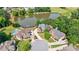 Aerial view of an upscale neighborhood with lake, community pool, and manicured landscaping at 652 Pathview Ct, Dacula, GA 30019