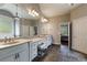 Spacious primary bath with double vanities, granite counters, tile floor and access to the bedroom at 652 Pathview Ct, Dacula, GA 30019