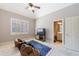 A nice bedroom features a vaulted ceiling, a television and an open door to a bathroom at 652 Pathview Ct, Dacula, GA 30019