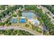 An aerial view of a community pool with tennis courts and well-manicured landscaping at 652 Pathview Ct, Dacula, GA 30019