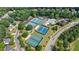 Community pool area with tennis courts surrounded by lush greenery in a well-maintained neighborhood at 652 Pathview Ct, Dacula, GA 30019