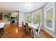 Bright dining area with large bay window, hardwood floors, and ample seating at 652 Pathview Ct, Dacula, GA 30019