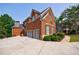 Lovely two-story brick home featuring an attached two car garage and meticulous landscaping at 652 Pathview Ct, Dacula, GA 30019