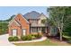 Beautiful brick and stone home with manicured lawn and professional landscaping at 652 Pathview Ct, Dacula, GA 30019