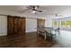 Spacious game room featuring a ping pong table, barn door access and great natural light at 652 Pathview Ct, Dacula, GA 30019