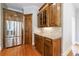 Kitchen with stainless steel refrigerator, custom cabinets, granite countertops, and hardwood floors at 652 Pathview Ct, Dacula, GA 30019