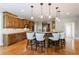 Well-equipped kitchen featuring a central island with seating, custom cabinetry, and stainless steel appliances at 652 Pathview Ct, Dacula, GA 30019