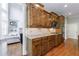 Gourmet kitchen featuring custom wood cabinets, granite countertops, and stainless steel appliances at 652 Pathview Ct, Dacula, GA 30019