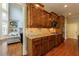 Gourmet kitchen featuring custom wood cabinets, granite countertops, and stainless steel appliances at 652 Pathview Ct, Dacula, GA 30019