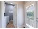Functional laundry room with washer, dryer, and an exit door with access to the pool at 652 Pathview Ct, Dacula, GA 30019