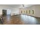 Large living room with luxury vinyl plank flooring, modern windows, and a contemporary dresser at 652 Pathview Ct, Dacula, GA 30019