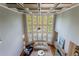 Bright living room featuring a soaring ceiling, large windows, and a stone fireplace at 652 Pathview Ct, Dacula, GA 30019