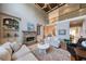 Spacious living area with soaring ceilings, stone fireplace, and ample natural light at 652 Pathview Ct, Dacula, GA 30019