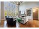 Open living space with soaring windows, fireplace, and access to a second-floor balcony at 652 Pathview Ct, Dacula, GA 30019