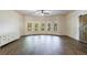 Bright living room with hardwood floors, ceiling fan and lots of natural light with a beautiful view at 652 Pathview Ct, Dacula, GA 30019