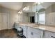 Spacious main bathroom with a walk-in shower, dual vanities, and natural light at 652 Pathview Ct, Dacula, GA 30019