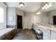 Spacious main bathroom with a jacuzzi tub, walk-in shower, and dual vanities at 652 Pathview Ct, Dacula, GA 30019
