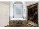 Main bathroom featuring a jacuzzi tub, walk-in shower, and tile floors at 652 Pathview Ct, Dacula, GA 30019