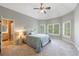 Spacious main bedroom with natural light from shuttered windows and ensuite bath with tiled shower at 652 Pathview Ct, Dacula, GA 30019