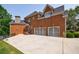 Lovely brick home featuring a two car garage, a rear entryway and lake access at 652 Pathview Ct, Dacula, GA 30019