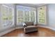 Sitting area with lots of windows, natural light, plantation shutters, and hardwood floors at 652 Pathview Ct, Dacula, GA 30019