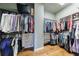 Custom walk-in closet with wood floors and built-in shelving providing ample storage space at 652 Pathview Ct, Dacula, GA 30019