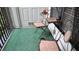 Relaxing balcony with bistro set and synthetic grass, perfect for enjoying the outdoors at 3275 Lenox Ne Rd # 110, Atlanta, GA 30324
