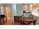 Cozy dining area adjacent to the bathroom, featuring hardwood floors at 3275 Lenox Ne Rd # 110, Atlanta, GA 30324