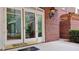 Exterior entrance featuring glass doors and brick facade at 3275 Lenox Ne Rd # 110, Atlanta, GA 30324
