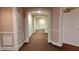 Well-maintained hallway with detailed trim and neutral decor leading to various units at 3275 Lenox Ne Rd # 110, Atlanta, GA 30324
