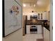 Well-equipped kitchen featuring stainless steel appliances and white cabinets for a clean design at 3275 Lenox Ne Rd # 110, Atlanta, GA 30324