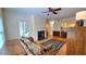 Bright living room featuring a fireplace, access to balcony, and hardwood floors at 3275 Lenox Ne Rd # 110, Atlanta, GA 30324