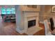 Cozy community living room with fireplace and a pool table in the background at 3275 Lenox Ne Rd # 110, Atlanta, GA 30324