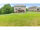 Large backyard featuring lush green grass and a deck; ideal for outdoor enjoyment and activities at 466 Sweet Apple Ln, Buford, GA 30518