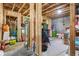Unfinished basement with exposed framing and concrete floor, presenting an opportunity for personalized renovation and storage at 466 Sweet Apple Ln, Buford, GA 30518