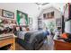 Bedroom with vaulted ceilings, lots of wall decor, and view of exterior through windows at 466 Sweet Apple Ln, Buford, GA 30518