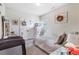 Cozy bedroom with neutral tones, a window, and a decorative wreath on the wall at 466 Sweet Apple Ln, Buford, GA 30518