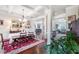 Bright dining room featuring coffered ceilings, hardwood floors, and an elegant chandelier at 466 Sweet Apple Ln, Buford, GA 30518