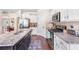 Granite countertops highlight this kitchen with stainless steel appliances and wood floors at 466 Sweet Apple Ln, Buford, GA 30518
