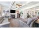 Spacious living room with a fireplace, large windows, and an open layout at 466 Sweet Apple Ln, Buford, GA 30518