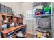 View of a storage space with built-in desk, shelving, and a neutral-colored carpet at 466 Sweet Apple Ln, Buford, GA 30518