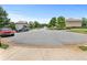 A quiet street lined with well-maintained homes, trees, and manicured lawns, showcasing community charm at 466 Sweet Apple Ln, Buford, GA 30518