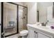 Modern bathroom with a tiled shower featuring a bench, and a vanity with sink at 4854 Cathedral Ct, Powder Springs, GA 30127