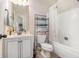 Bright bathroom with a shower and a sink at 4854 Cathedral Ct, Powder Springs, GA 30127
