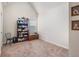 Bright, carpeted room with vaulted ceilings and bookshelf at 4854 Cathedral Ct, Powder Springs, GA 30127
