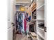 Organized walk-in closet featuring shelving and hanging storage, perfect for maximizing space and keeping belongings tidy at 4854 Cathedral Ct, Powder Springs, GA 30127