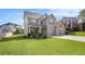 Beautiful brick home with a three-car garage, well-maintained landscaping, and a spacious driveway at 4854 Cathedral Ct, Powder Springs, GA 30127
