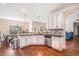 Well-lit kitchen with ample counter space, stainless steel appliances, and open layout at 4854 Cathedral Ct, Powder Springs, GA 30127